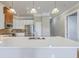 Bright kitchen features stainless steel appliances, white cabinets, granite countertops and island sink at 200 River Landing Dr # 307B, Charleston, SC 29492