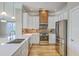 Modern kitchen featuring stainless steel appliances, white cabinets, and wood floors at 200 River Landing Dr # 307B, Charleston, SC 29492