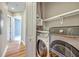 Convenient laundry area equipped with modern appliances and storage solutions at 200 River Landing Dr # 307B, Charleston, SC 29492