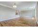 Open-concept living room with hardwood floors, recessed lighting, and a view of the modern kitchen at 200 River Landing Dr # 307B, Charleston, SC 29492