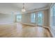 Bright living room featuring hardwood floors, a ceiling fan and access to a private balcony at 200 River Landing Dr # 307B, Charleston, SC 29492