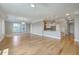 Open-concept living room with hardwood floors connects to the kitchen and features lots of natural light at 200 River Landing Dr # 307B, Charleston, SC 29492