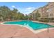 Inviting community pool surrounded by lush landscaping and lounge chairs for relaxation at 200 River Landing Dr # 307B, Charleston, SC 29492