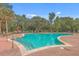 Refreshing community pool featuring multiple access points, lounge seating, and lush greenery at 200 River Landing Dr # 307B, Charleston, SC 29492