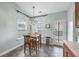 Charming breakfast nook with natural light and a modern hanging pendant at 201 Maywood Dr, Moncks Corner, SC 29461