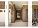 Covered front entry featuring a brick wall, two rocking chairs, and a decorative front door at 201 Maywood Dr, Moncks Corner, SC 29461