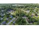 Aerial view of a neighborhood with tree-lined streets and varied home styles, creating a serene environment at 202 Woodbridge Dr, Summerville, SC 29486