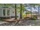 Backyard featuring a wooden deck, a stone-lined fire pit, and outdoor grilling area, perfect for entertaining at 202 Woodbridge Dr, Summerville, SC 29486