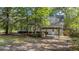 Spacious backyard featuring a covered patio and grill area, perfect for outdoor dining and relaxation at 202 Woodbridge Dr, Summerville, SC 29486