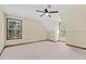 Bright bedroom with neutral carpet, trim, and paint; ceiling fan at 202 Woodbridge Dr, Summerville, SC 29486