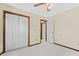 Bright bedroom featuring a closet and doors; neutral paint, carpet, and trim at 202 Woodbridge Dr, Summerville, SC 29486