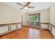 Dining room featuring wood floors, panel molding, a large window, and neutral paint at 202 Woodbridge Dr, Summerville, SC 29486