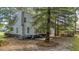 Well-maintained home with a spacious yard, deck, and outdoor grill area, perfect for outdoor living at 202 Woodbridge Dr, Summerville, SC 29486