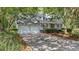 Charming home with an attached two-car garage and long driveway at 202 Woodbridge Dr, Summerville, SC 29486