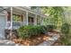 Charming home's front porch and lush landscaping create an inviting entry at 202 Woodbridge Dr, Summerville, SC 29486