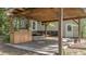 Outdoor kitchen and grill area with a pergola offering a perfect spot for backyard BBQs and gatherings at 202 Woodbridge Dr, Summerville, SC 29486