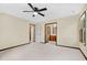 Spacious main bedroom with a window, neutral carpet, trim, and paint at 202 Woodbridge Dr, Summerville, SC 29486