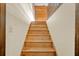 Wooden staircase leads to the second floor with white walls and wood-paneled accents at 202 Woodbridge Dr, Summerville, SC 29486