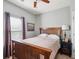 Cozy bedroom with wood furniture, a ceiling fan and natural lighting at 2329 Tall Sail Dr # 704D, Charleston, SC 29414