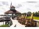 Picturesque gazebo with seating overlooks the water, offering a perfect spot for relaxation at 2329 Tall Sail Dr # 704D, Charleston, SC 29414