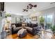 Open concept living room with access to balcony and hardwood flooring at 2329 Tall Sail Dr # 704D, Charleston, SC 29414