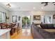 Bright living room with access to a balcony, dining area and neutral paint at 2329 Tall Sail Dr # 704D, Charleston, SC 29414