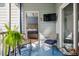 Inviting porch with comfortable seating, tv and a bedroom view at 2329 Tall Sail Dr # 704D, Charleston, SC 29414