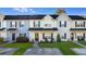 Inviting townhome featuring a well-maintained lawn and charming outdoor seating at 282 Swallowtail Ln, Goose Creek, SC 29445