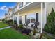 Cozy front porch featuring outdoor seating and well-maintained landscaping at 282 Swallowtail Ln, Goose Creek, SC 29445
