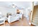 Inviting living room with hardwood floors, a ceiling fan, and a staircase at 282 Swallowtail Ln, Goose Creek, SC 29445