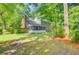 Large backyard with brick home and screened-in porch at 303 High Grove Rd, Summerville, SC 29485