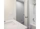 Bathroom featuring a white tile shower, tub, quartz countertop, and open doorway at 303 High Grove Rd, Summerville, SC 29485