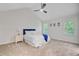 Spacious bedroom features a vaulted ceiling, carpet, natural light, and blue accents at 303 High Grove Rd, Summerville, SC 29485