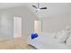 Bright bedroom features a vaulted ceiling, white walls, carpet, and a glimpse into the bathroom at 303 High Grove Rd, Summerville, SC 29485