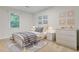 Bedroom with a twin bed, beige carpet, white walls, and decorative animal artwork at 303 High Grove Rd, Summerville, SC 29485
