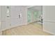 Bright foyer featuring hardwood floors and a view into the adjacent office space with french doors at 303 High Grove Rd, Summerville, SC 29485