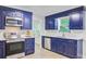 Kitchen featuring stainless steel appliances, stylish blue cabinets, and modern countertops at 303 High Grove Rd, Summerville, SC 29485