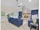 Spacious living room featuring a brick fireplace, vaulted ceiling, and blue built-in shelves at 303 High Grove Rd, Summerville, SC 29485