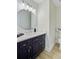 Stylish powder room featuring a modern vanity with a round mirror and modern lighting at 303 High Grove Rd, Summerville, SC 29485