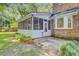 Exterior of a brick home with a screened-in porch at 303 High Grove Rd, Summerville, SC 29485