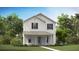 Charming two-story home with white siding, a covered porch, and lush landscaping at 304 Archar St, Summerville, SC 29486