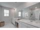 Spacious main bathroom with double vanities, a large mirror, and a walk-in shower at 304 Archar St, Summerville, SC 29486
