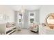 Charming Bedroom with soft colors, natural light, and a cozy rocking chair, creating a warm and inviting space at 306 Archar St, Summerville, SC 29486