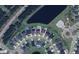 Community aerial view showcasing the neighborhood layout, amenities, and proximity to a lake at 316 Beachgrass Ln, Summerville, SC 29486