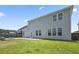 Rear exterior of the home featuring a patio, lawn, and backyard fire pit at 316 Beachgrass Ln, Summerville, SC 29486