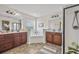 Bathroom featuring double sinks, granite countertops, large soaking tub and walk-in shower at 316 Beachgrass Ln, Summerville, SC 29486