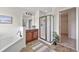 Bathroom featuring a soaking tub, walk-in shower, and vanity with a view to walk-in closet at 316 Beachgrass Ln, Summerville, SC 29486