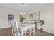 Elegant dining room with seating for six, stylish chandelier, and modern artwork at 316 Beachgrass Ln, Summerville, SC 29486