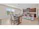 Open concept dining room with large windows and views of the outside at 316 Beachgrass Ln, Summerville, SC 29486