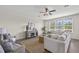 Bright and airy living room featuring a ceiling fan and lots of natural light at 316 Beachgrass Ln, Summerville, SC 29486